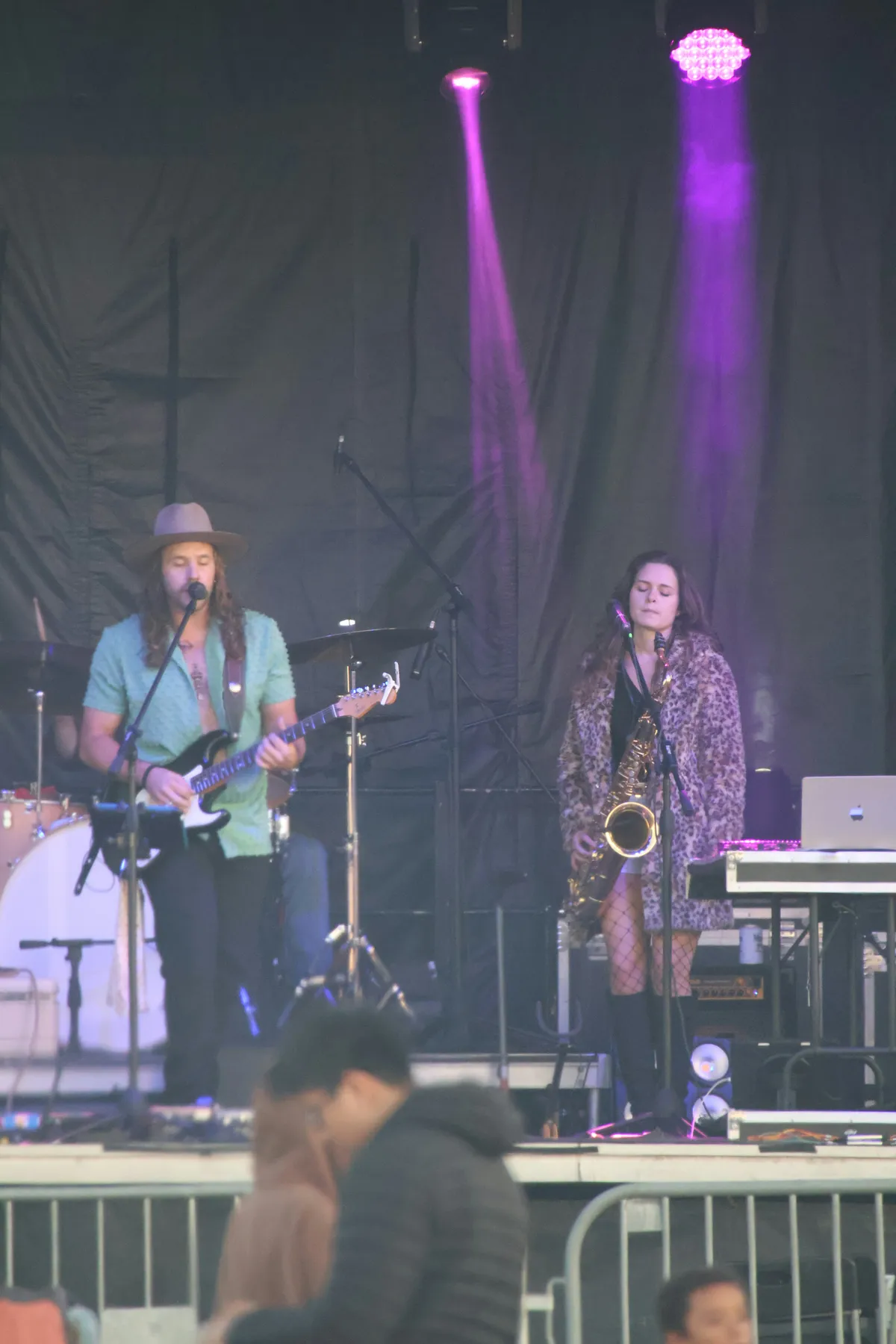A band playing on an outdoor stage