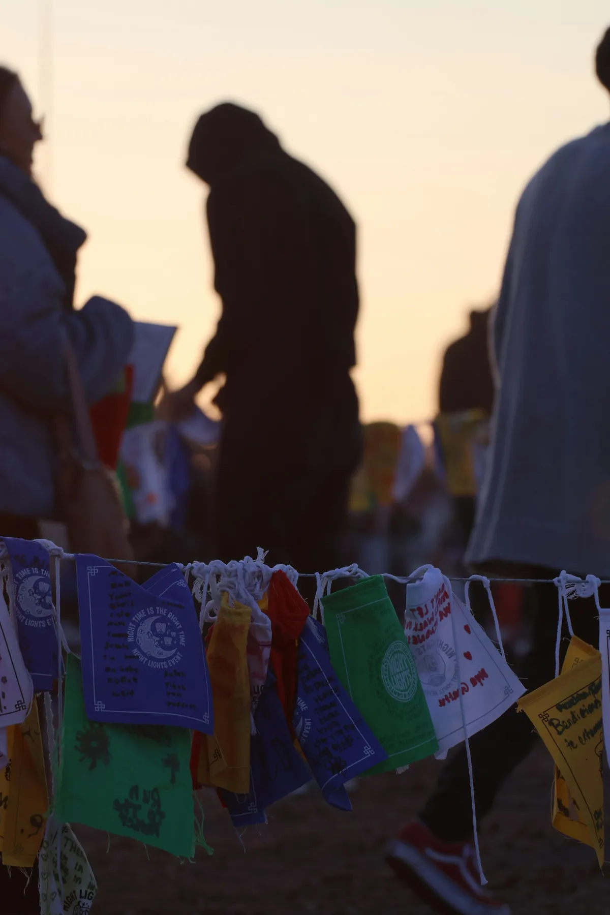 Prayer flags against a dusk sky